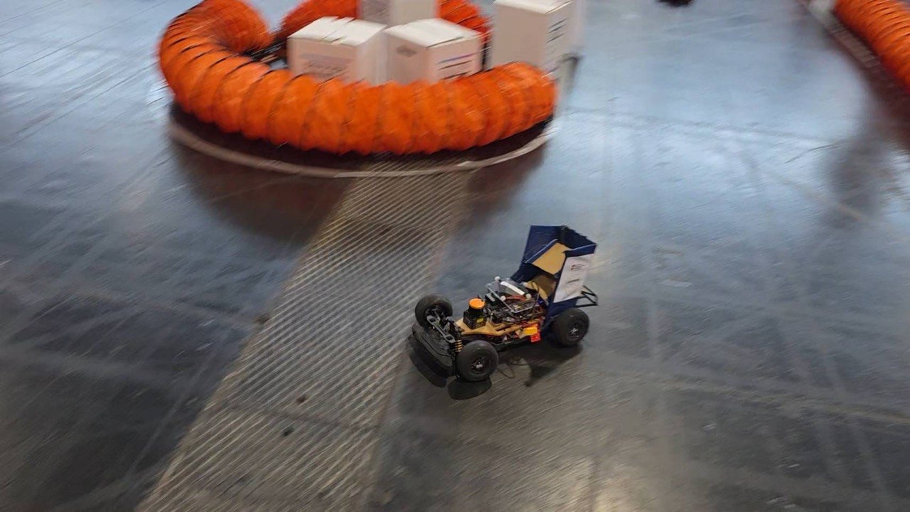 The car cornering past the orange barriers during the Classic Cup