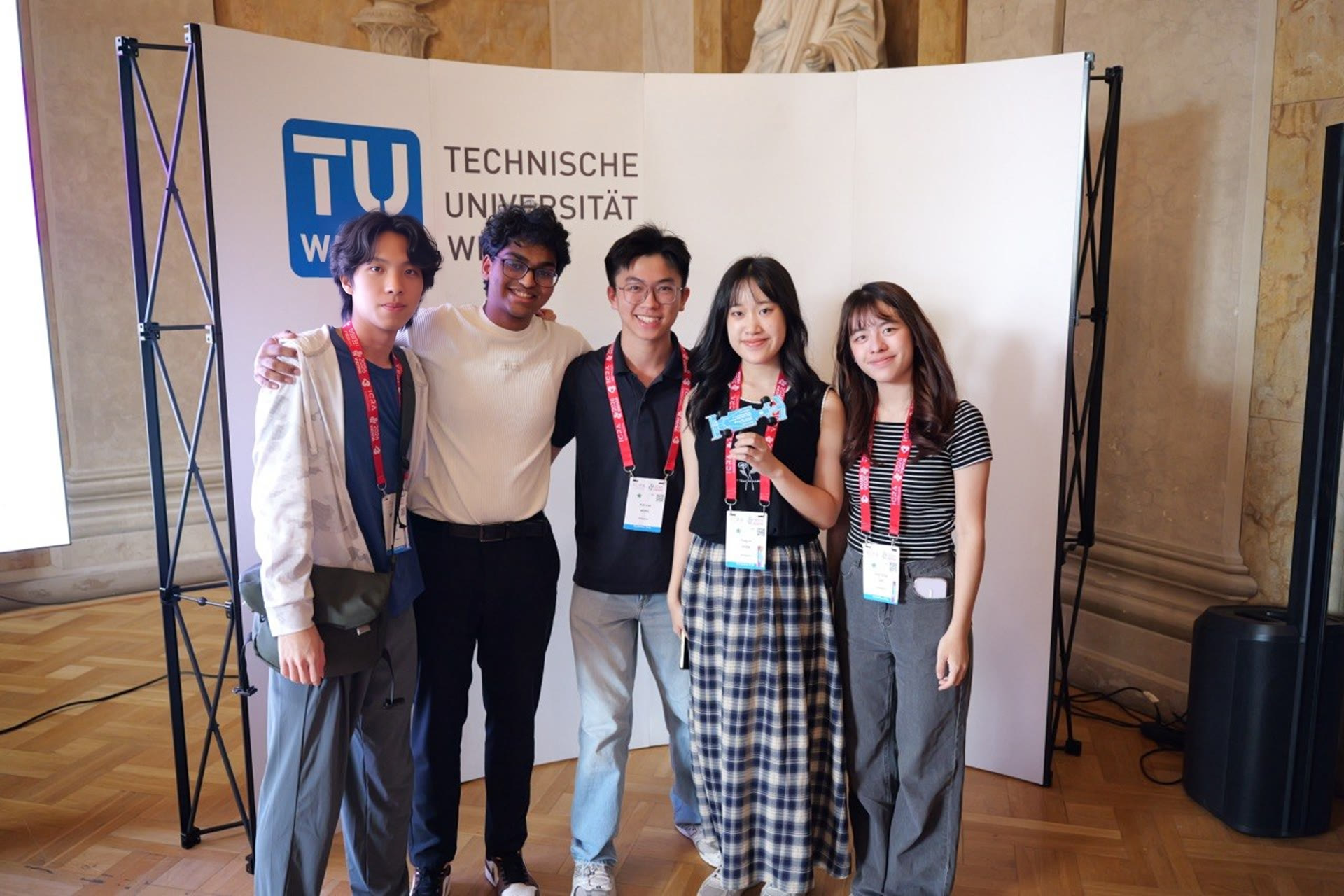 Team members at the TU Wien stand during the Sim Racing League
